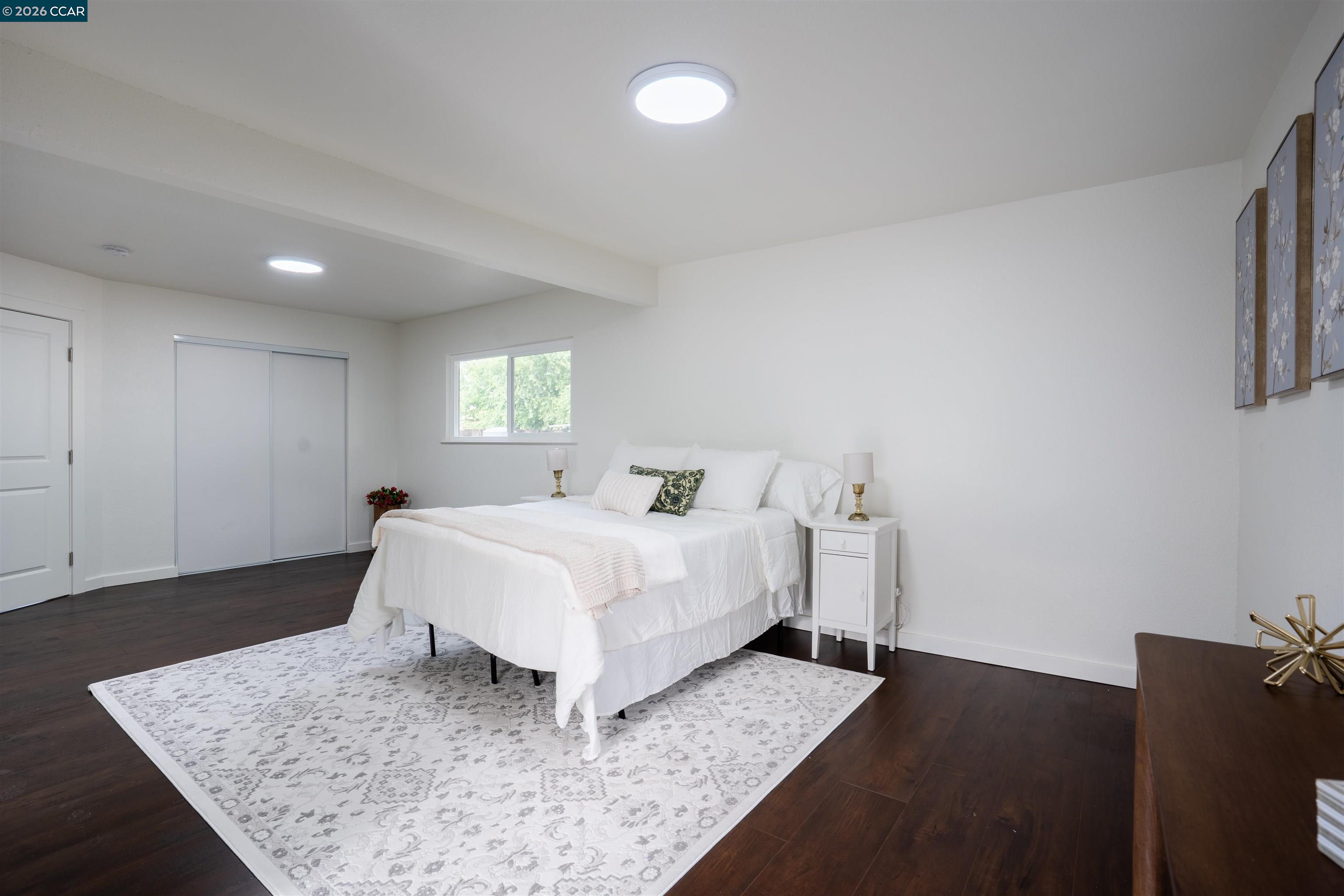 58 Solano Avenue Bay Point, CA 94565 - Photo 13 of 23 a bed sitting in a spacious bedroom next to a window