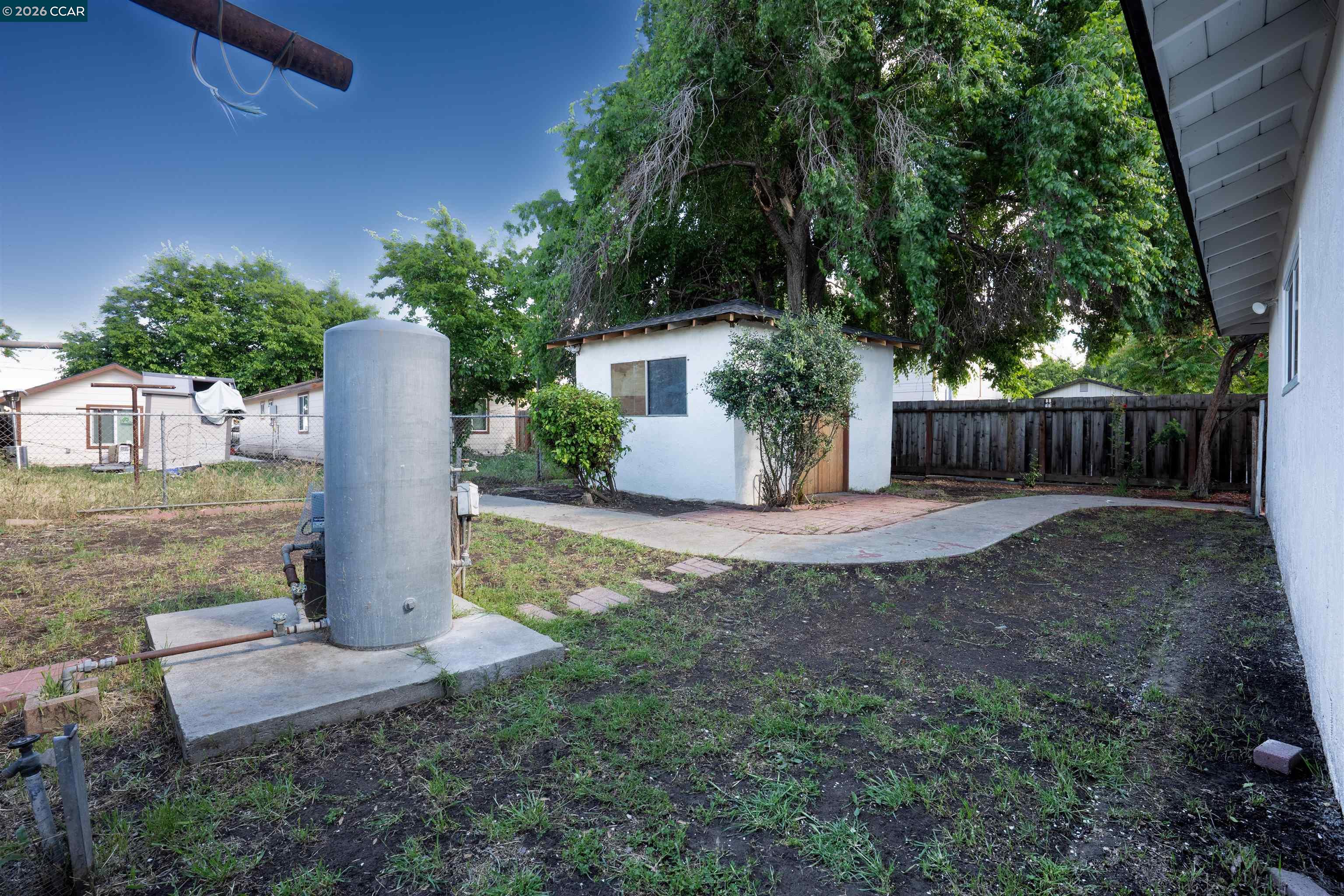 58 Solano Avenue Bay Point, CA 94565 - Photo 20 of 23 a view of a house with backyard and a tree