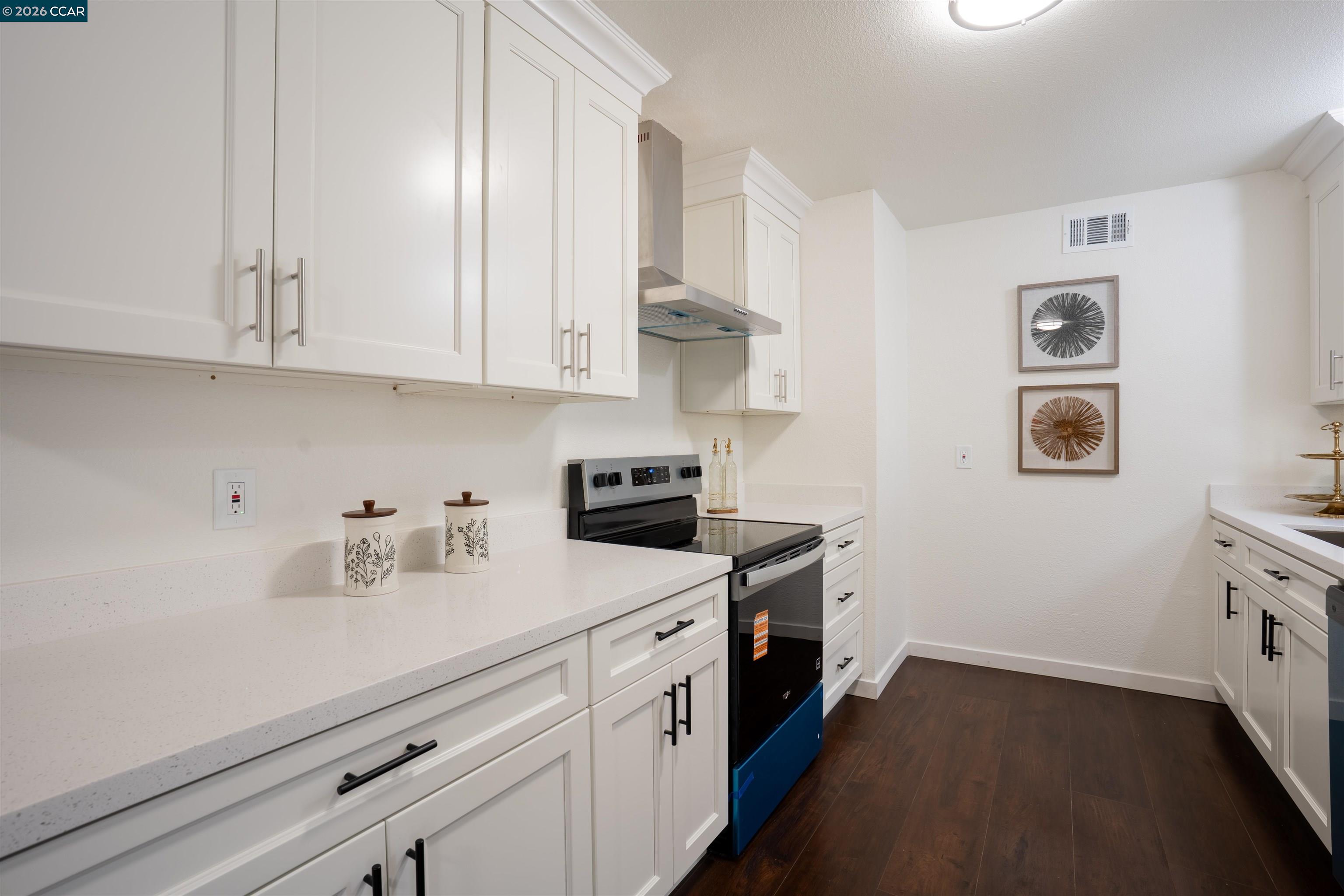 58 Solano Avenue Bay Point, CA 94565 - Photo 3 of 23 a kitchen with stainless steel appliances granite countertop a sink a stove and a refrigerator