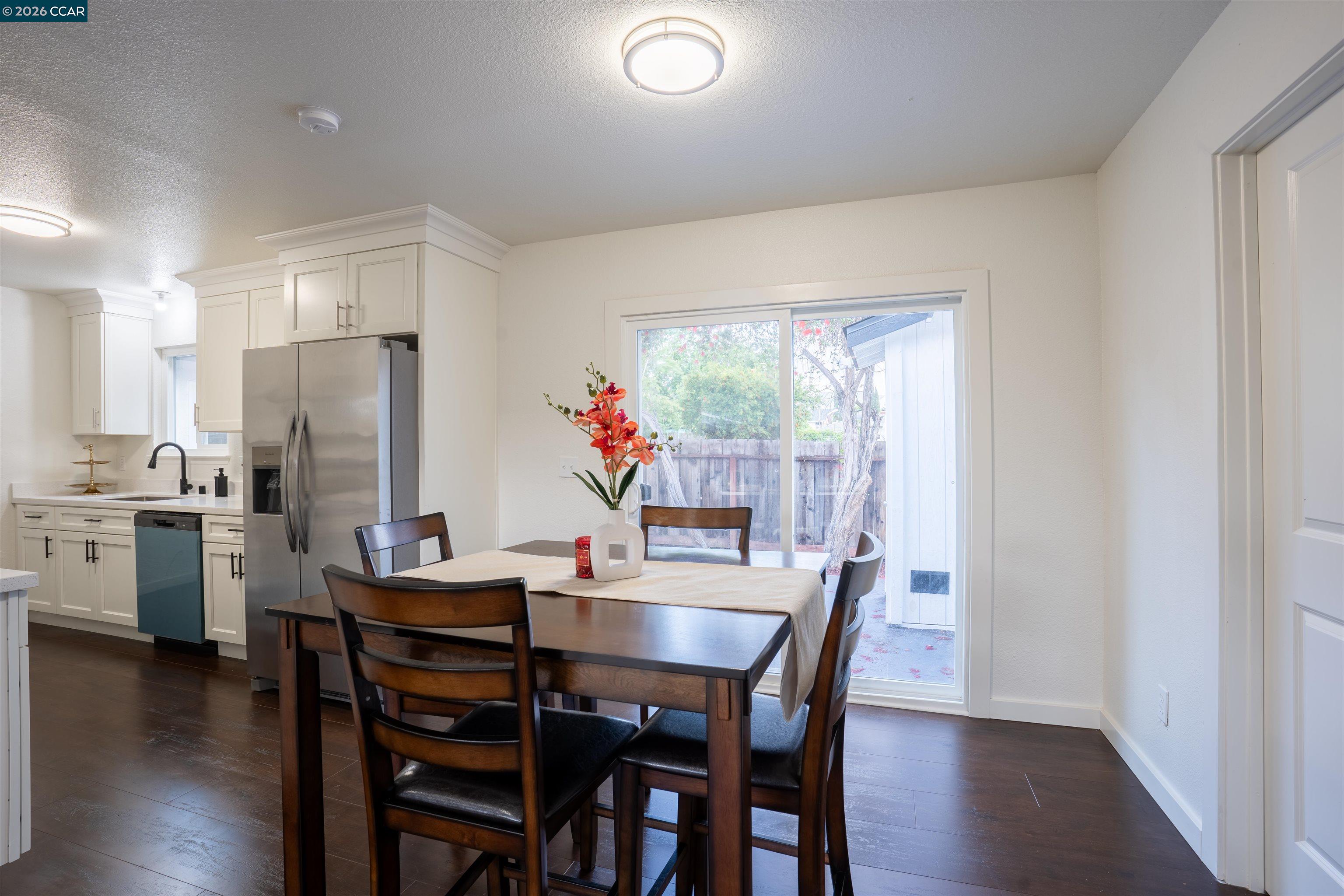 58 Solano Avenue Bay Point, CA 94565 - Photo 5 of 23 a dining room with furniture and wooden floor