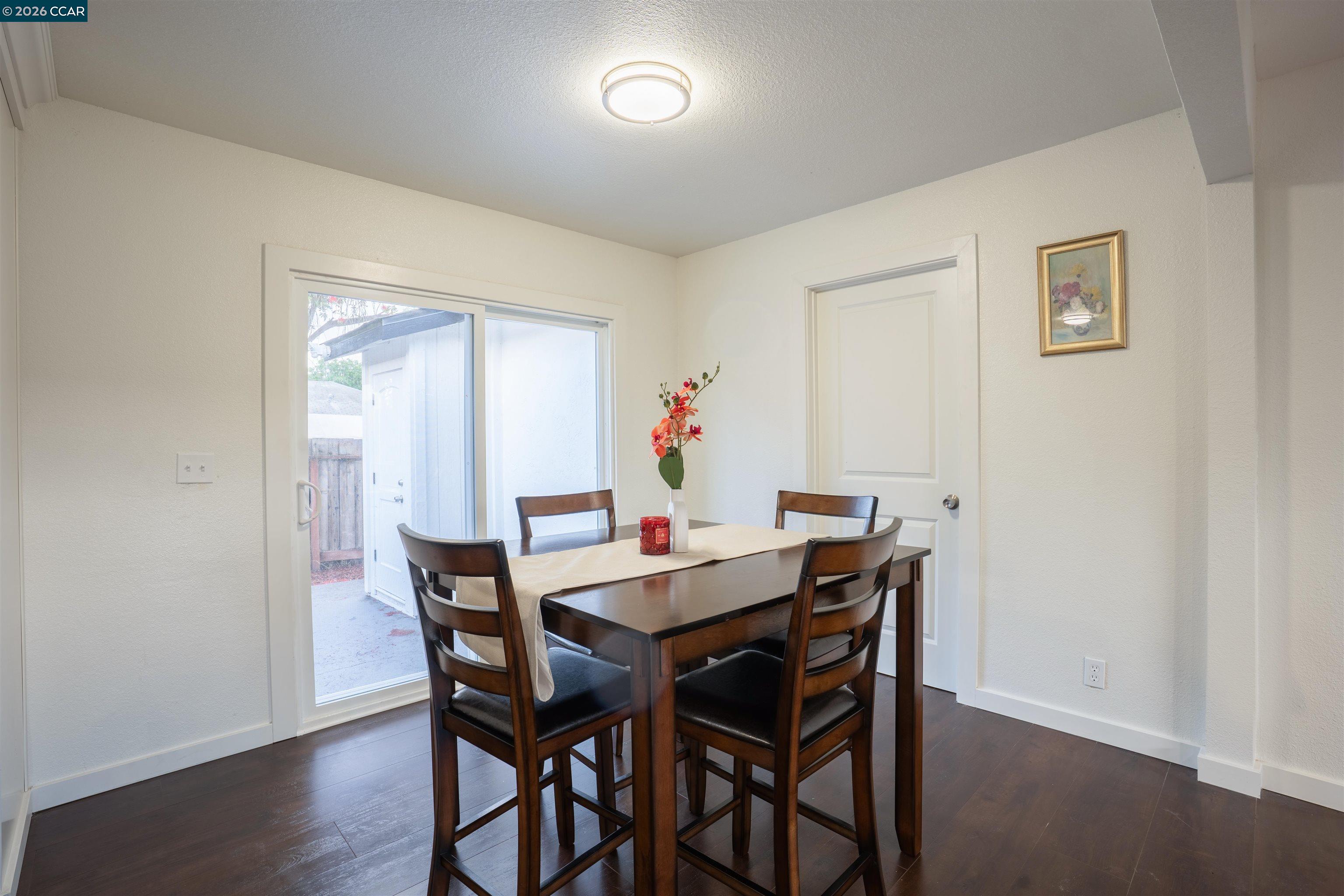 58 Solano Avenue Bay Point, CA 94565 - Photo 6 of 23 a view of a dining room with furniture and wooden floor