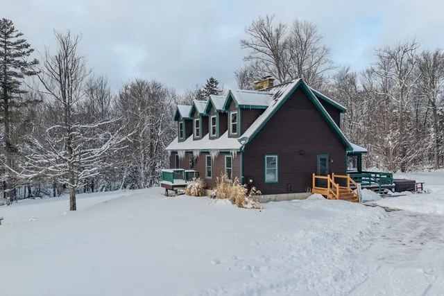 a view of a house with outdoor space and sitting area