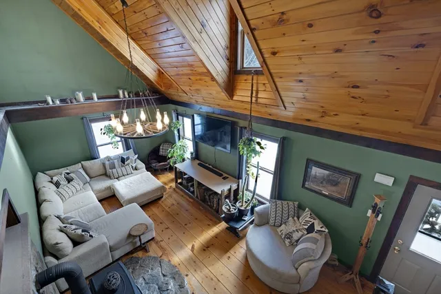 a living room with furniture and fireplace