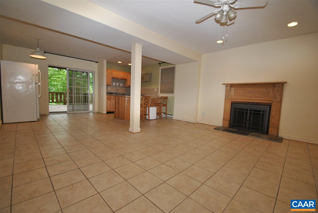114 Elkhorn Road Charlottesville, VA 22903 - Photo 12 of 23 an empty room with windows and fireplace