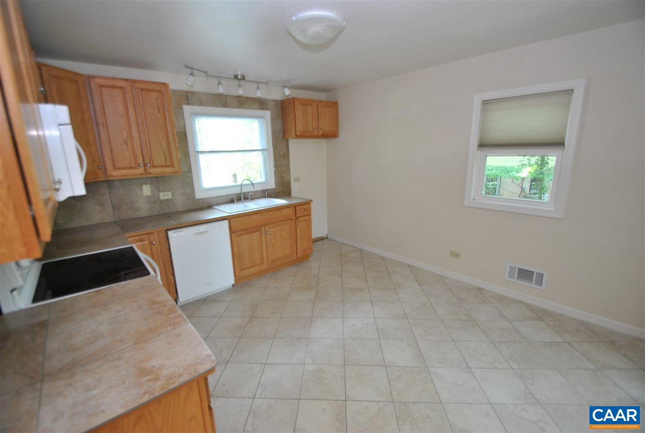 114 Elkhorn Road Charlottesville, VA 22903 - Photo 13 of 23 a large kitchen with granite countertop a sink and a stove