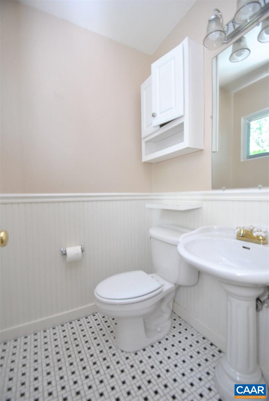 114 Elkhorn Road Charlottesville, VA 22903 - Photo 16 of 23 a bathroom with a sink a toilet and mirror
