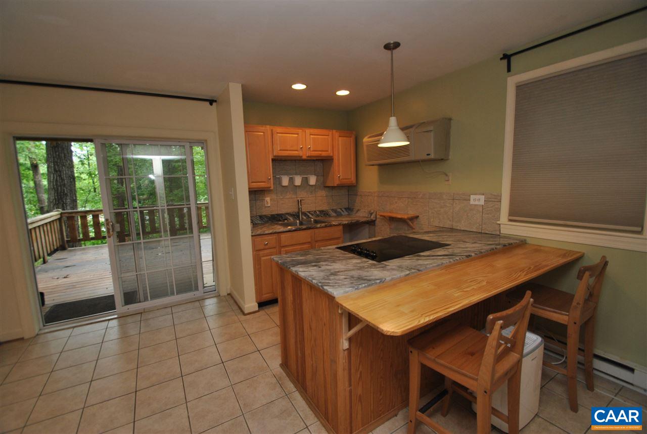 114 Elkhorn Road Charlottesville, VA 22903 - Photo 20 of 23 a kitchen with a sink cabinets and wooden floor