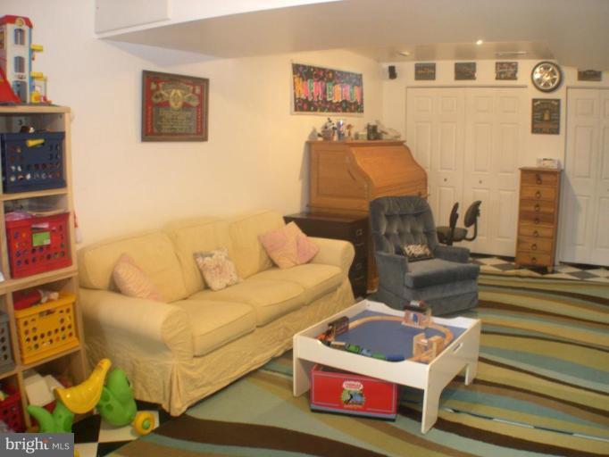 3202 Atlee Ridge Road New Windsor, MD 21776 - Photo 11 of 19 a living room with furniture and a couch