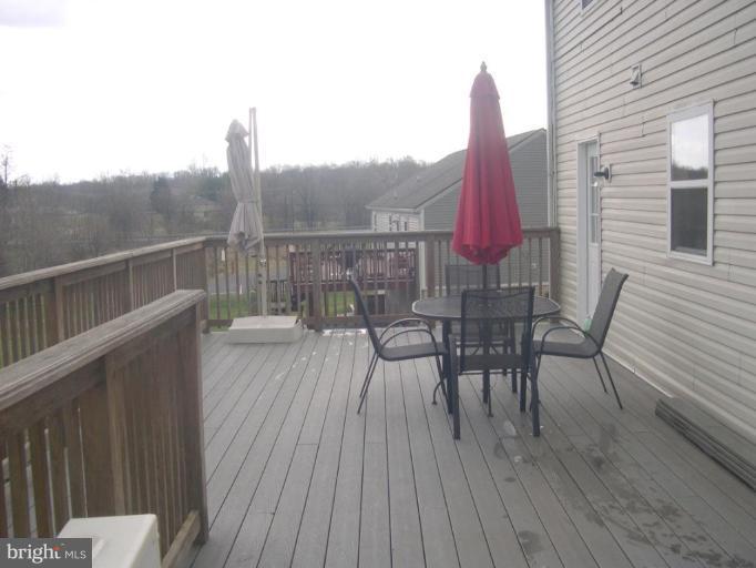 3202 Atlee Ridge Road New Windsor, MD 21776 - Photo 13 of 19 a view of a chairs and table on the deck