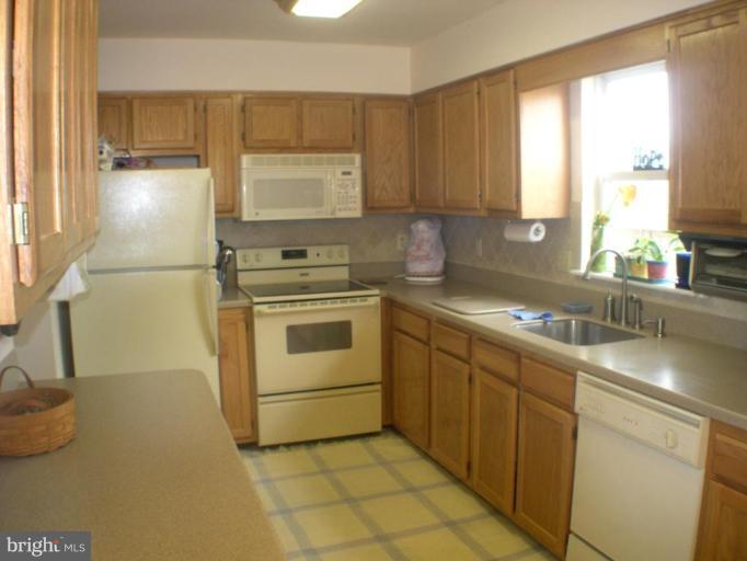 3202 Atlee Ridge Road New Windsor, MD 21776 - Photo 4 of 19 a kitchen with a sink cabinets and window