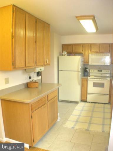 3202 Atlee Ridge Road New Windsor, MD 21776 - Photo 5 of 19 a kitchen with a sink cabinets and appliances