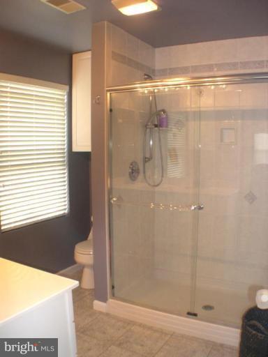 3202 Atlee Ridge Road New Windsor, MD 21776 - Photo 8 of 19 a bathroom with a shower and a toilet