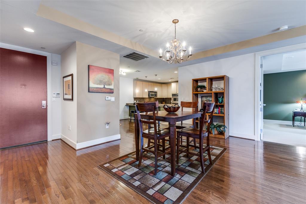 1505 Elm Street, Unit 1401 Dallas, TX 75201 - Photo 2 of 35 a view of a livingroom with furniture and wooden floor