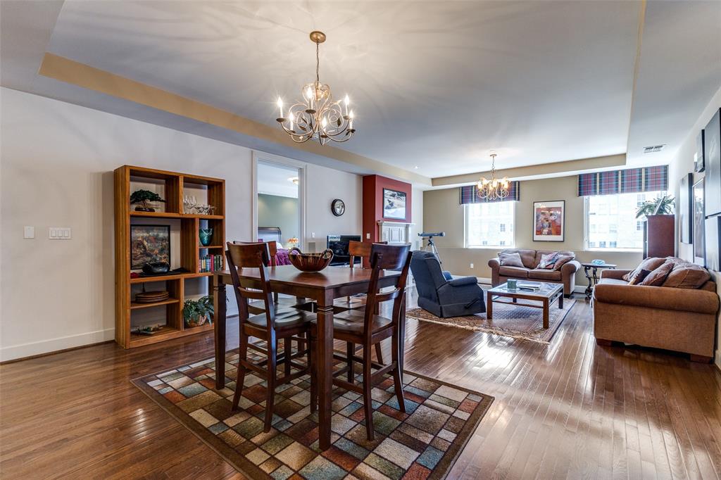 1505 Elm Street, Unit 1401 Dallas, TX 75201 - Photo 3 of 35 a view of a dining room with furniture window and wooden floor
