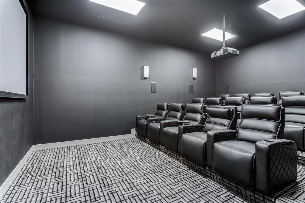 1505 Elm Street, Unit 1401 Dallas, TX 75201 - Photo 32 of 35 a media room with lots of chairs and a projector
