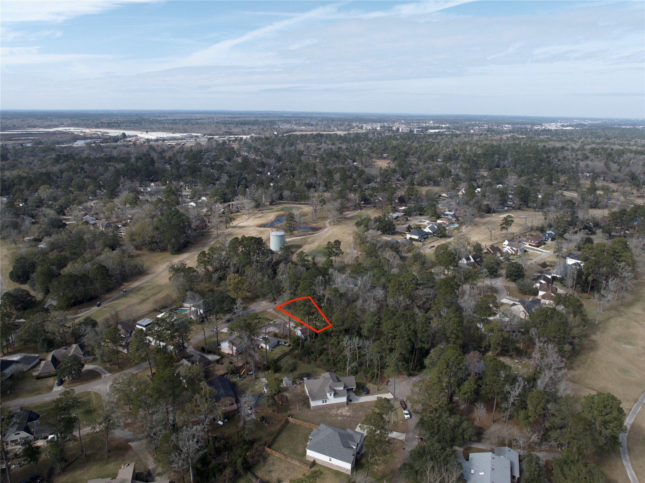 20 Brandon Road Conroe, TX 77302 - Photo 16 of 17 an aerial view of residential houses with city view
