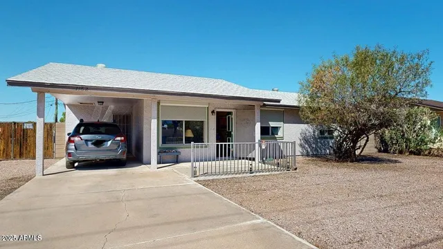 a view of a car park in front of house