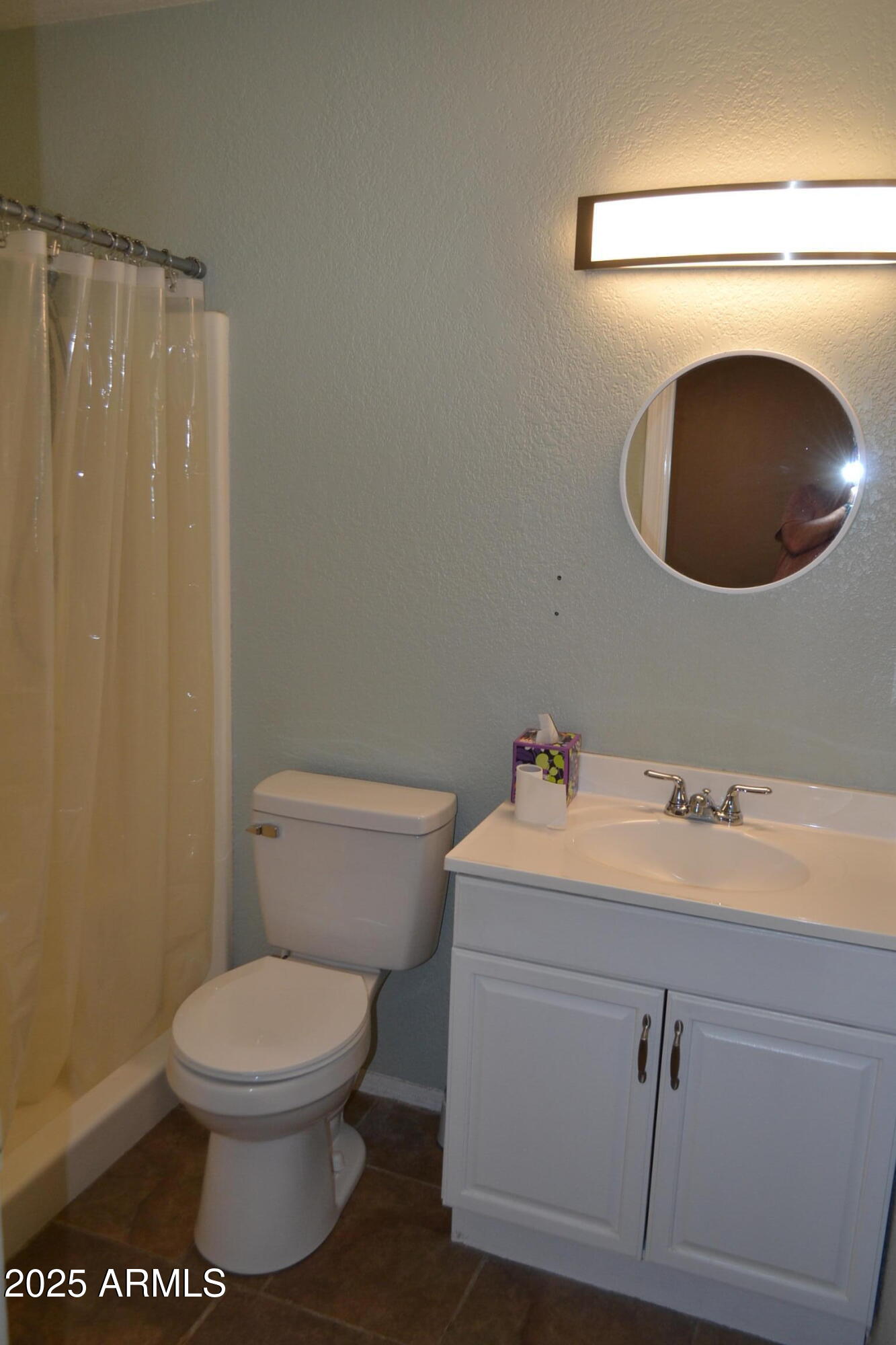 1162 South Ironwood Drive Apache Junction, AZ 85120 - Photo 11 of 14 a white toilet sitting next to a bathroom sink