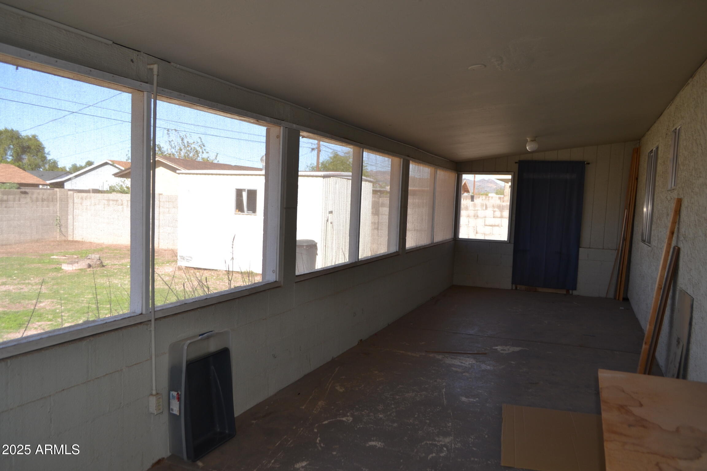 1162 South Ironwood Drive Apache Junction, AZ 85120 - Photo 12 of 14 a view of an empty room with large windows