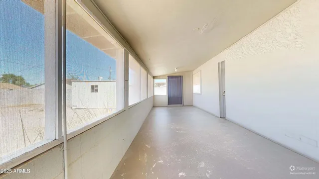 a view of hallway with windows