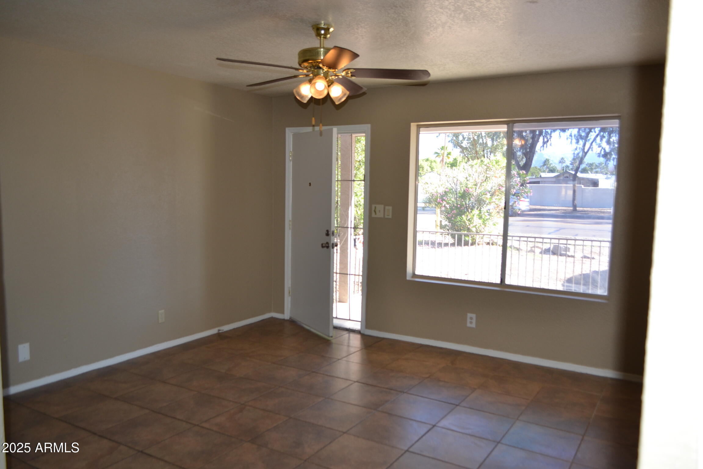 1162 South Ironwood Drive Apache Junction, AZ 85120 - Photo 3 of 14 a view of an empty room with a window