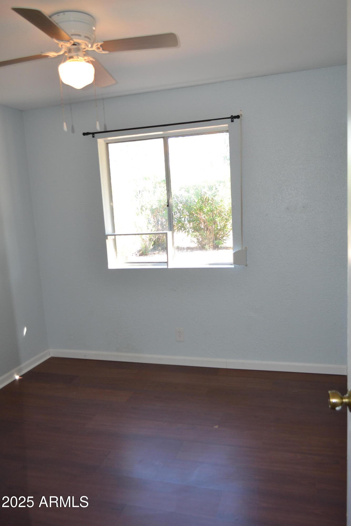 1162 South Ironwood Drive Apache Junction, AZ 85120 - Photo 9 of 14 an empty room with a window