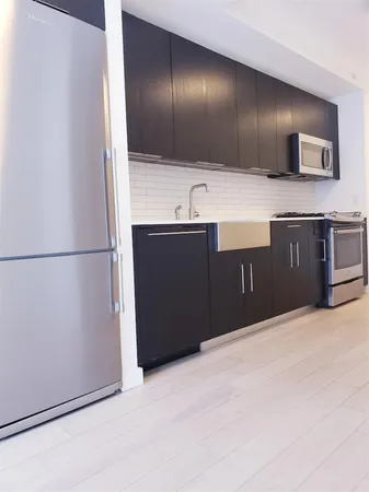 a bathroom with a sink and a large mirror