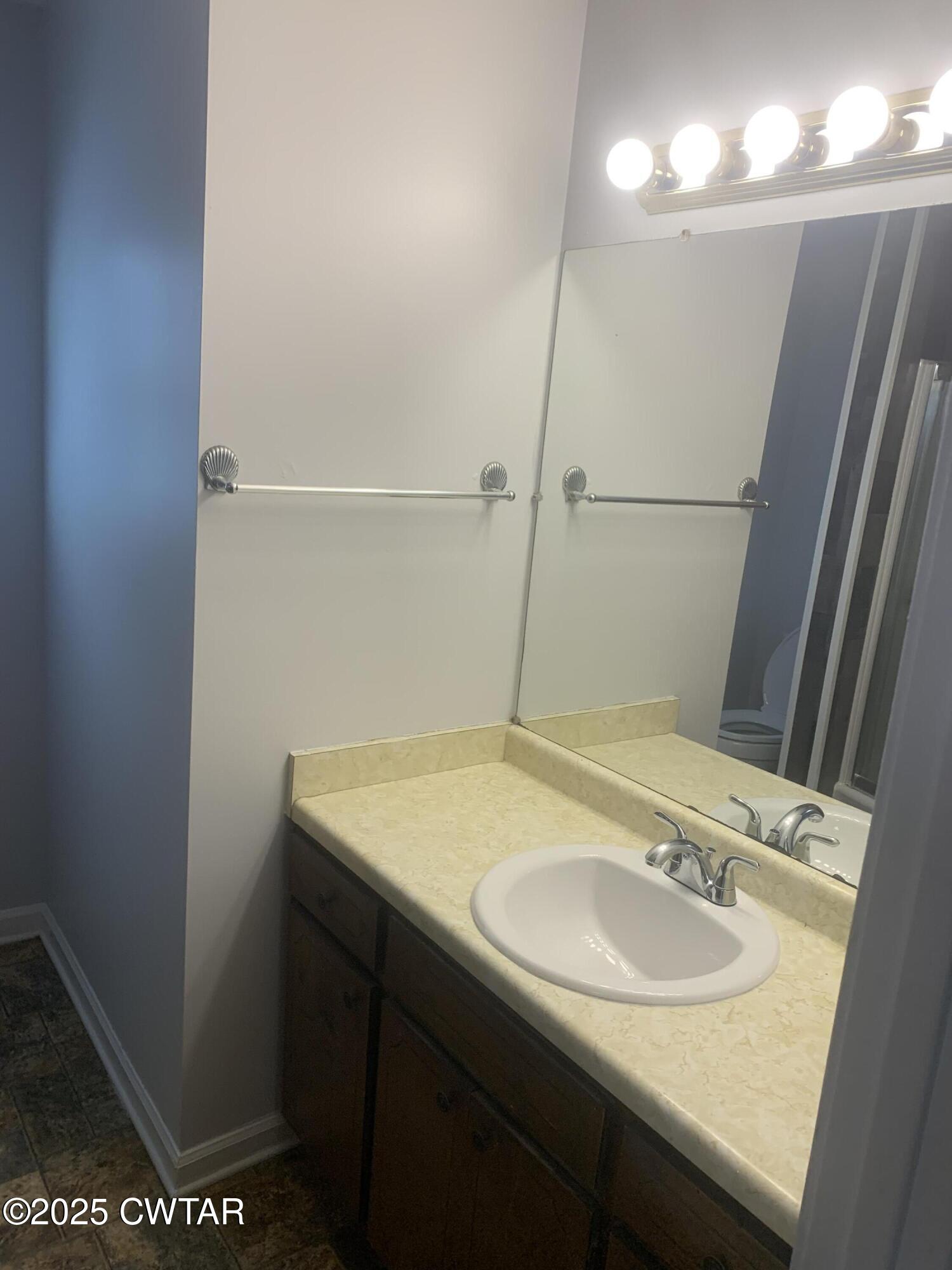 72 Laneview-Concord Road Trenton, TN 38382 - Photo 25 of 39 a bathroom with a sink and a mirror