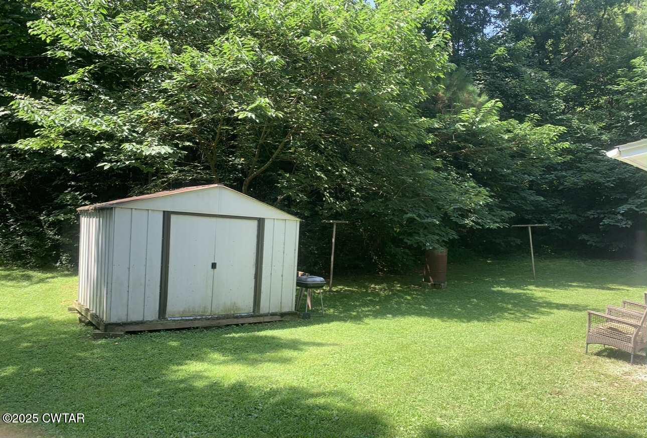 72 Laneview-Concord Road Trenton, TN 38382 - Photo 8 of 39 a backyard of a house with lots of green space