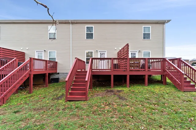 a view of a deck with a yard