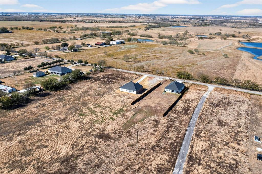 740 Section House Road Ennis, TX 75119 - Photo 31 of 31 an aerial view of residential building and ocean view in back