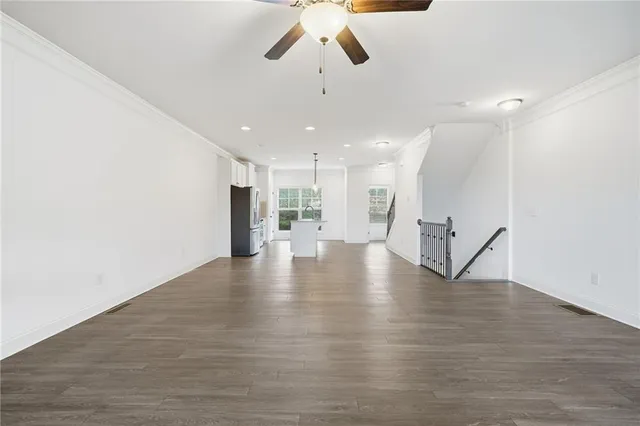 a kitchen with stainless steel appliances a refrigerator sink and microwave