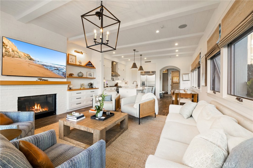 61 The Colonnade Long Beach, CA 90803 - Photo 14 of 49 a living room with furniture fireplace and a large window