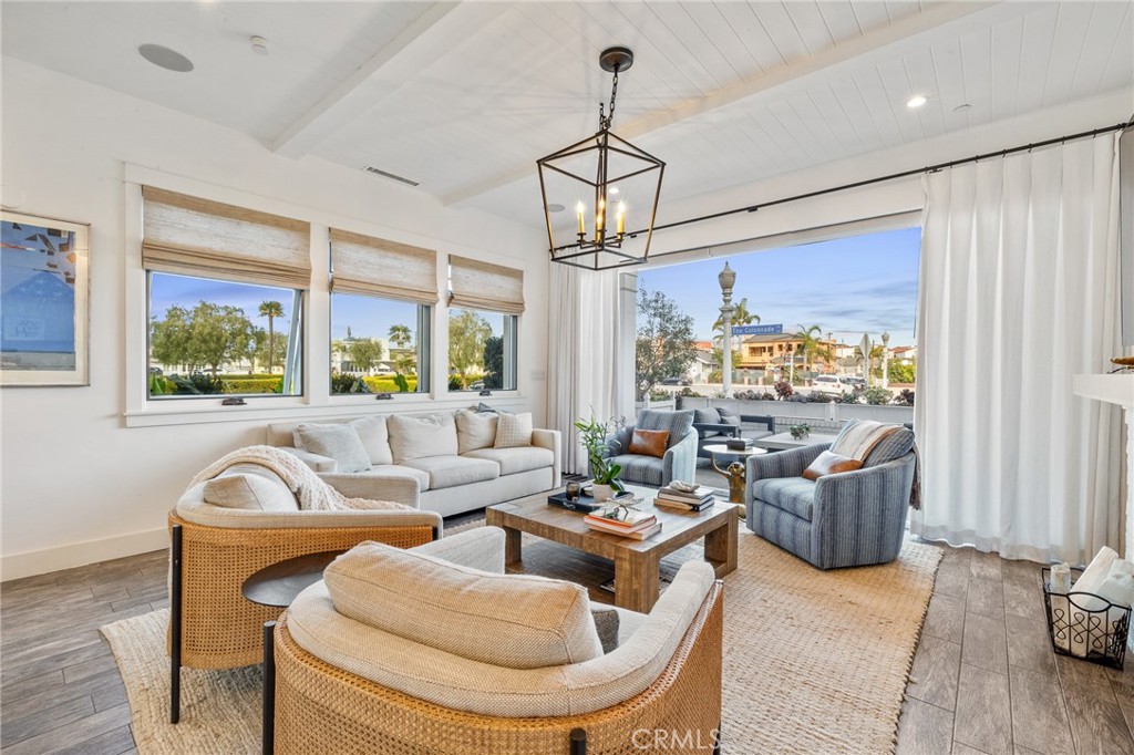 61 The Colonnade Long Beach, CA 90803 - Photo 17 of 49 a living room with furniture and a chandelier
