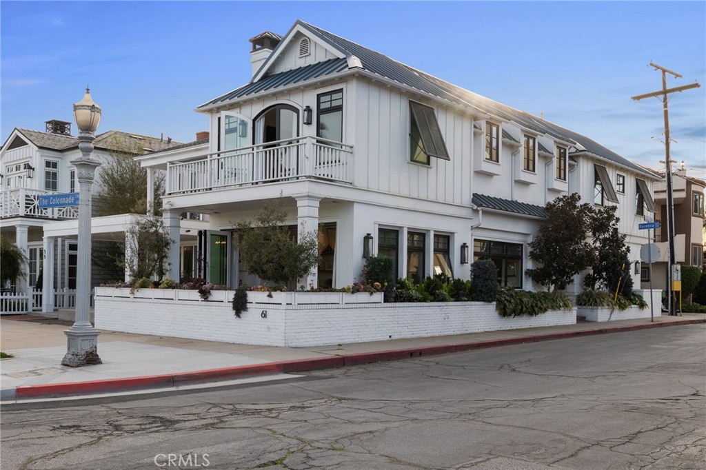 61 The Colonnade Long Beach, CA 90803 - Photo 2 of 49 a front view of a building with street