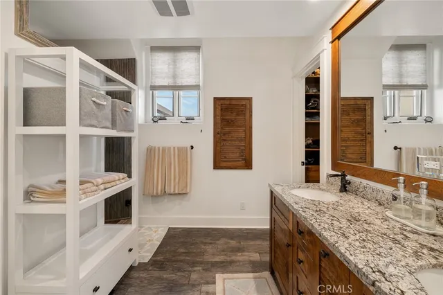 a bathroom with a shower and a sink
