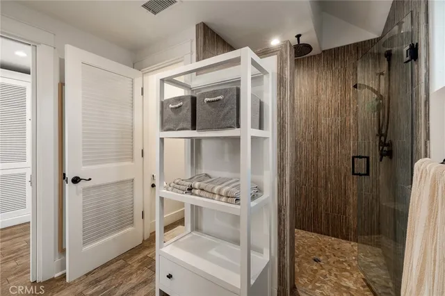 a view of a walk in closet and bedroom
