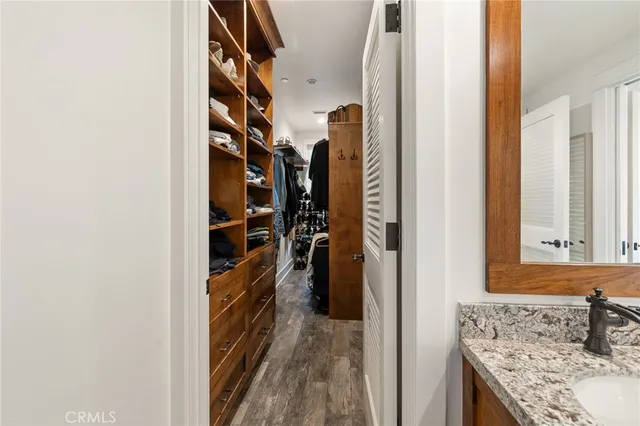 a bathroom with a granite countertop sink mirror and double
