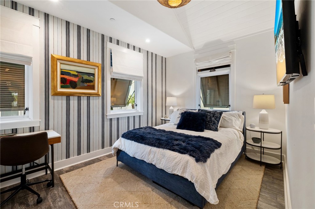 61 The Colonnade Long Beach, CA 90803 - Photo 38 of 49 a bedroom with a bed and a flat screen tv