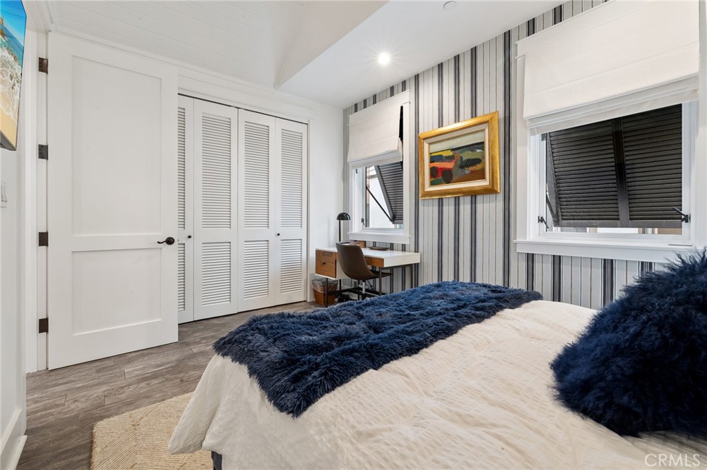 61 The Colonnade Long Beach, CA 90803 - Photo 39 of 49 a bedroom with a bed window and a flat screen television