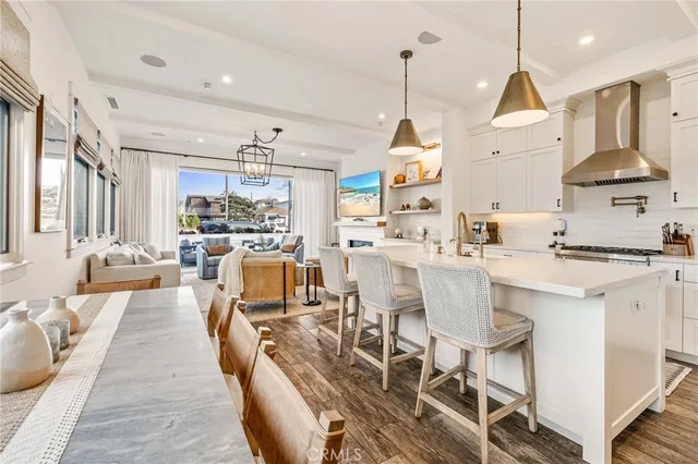 a large kitchen with a table and chairs
