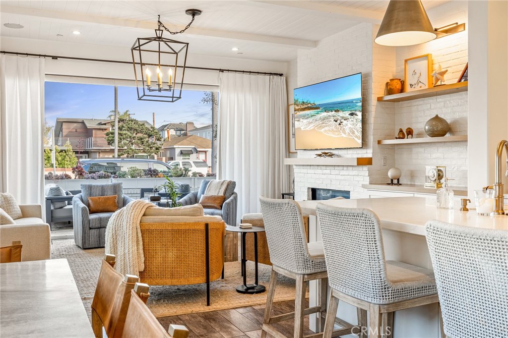 61 The Colonnade Long Beach, CA 90803 - Photo 7 of 49 a view of a dining room with furniture a chandelier and wooden floor