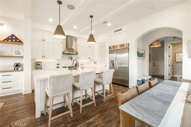 a dining room with furniture and wooden floor