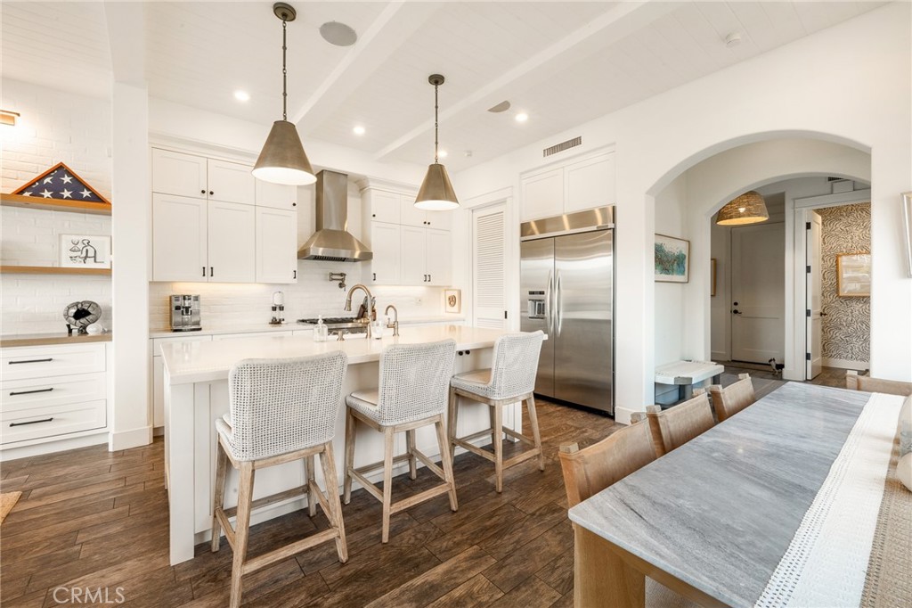 61 The Colonnade Long Beach, CA 90803 - Photo 8 of 49 a dining room with furniture and wooden floor