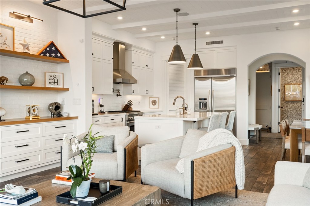61 The Colonnade Long Beach, CA 90803 - Photo 9 of 49 a living room with furniture and a chandelier