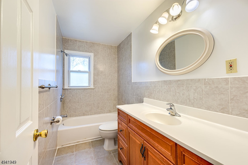857 Cherry Hill Road Princeton, NJ 08540 - Photo 12 of 22 a bathroom with a sink a toilet and a mirror