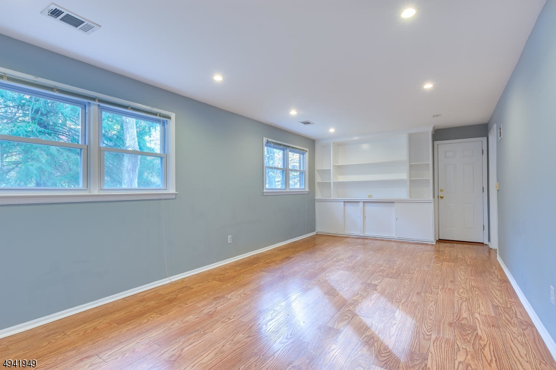 857 Cherry Hill Road Princeton, NJ 08540 - Photo 17 of 22 a view of an empty room with a window and wooden floor