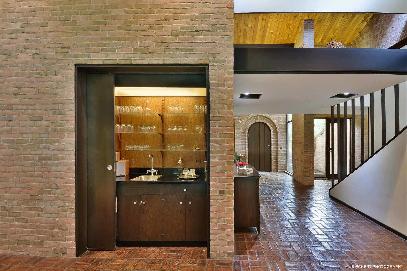 2345 Old Mill Road Lake Forest, IL 60045 - Photo 13 of 73 a view of a hallway with wooden floor and a fireplace