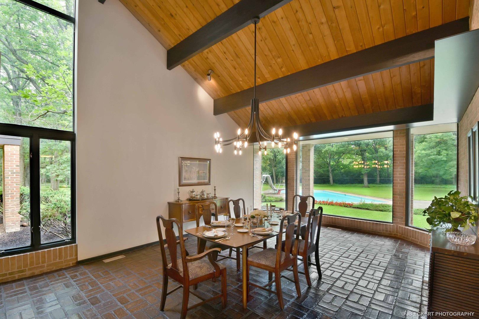 2345 Old Mill Road Lake Forest, IL 60045 - Photo 15 of 73 a view of a dining table and chairs in patio with a yard