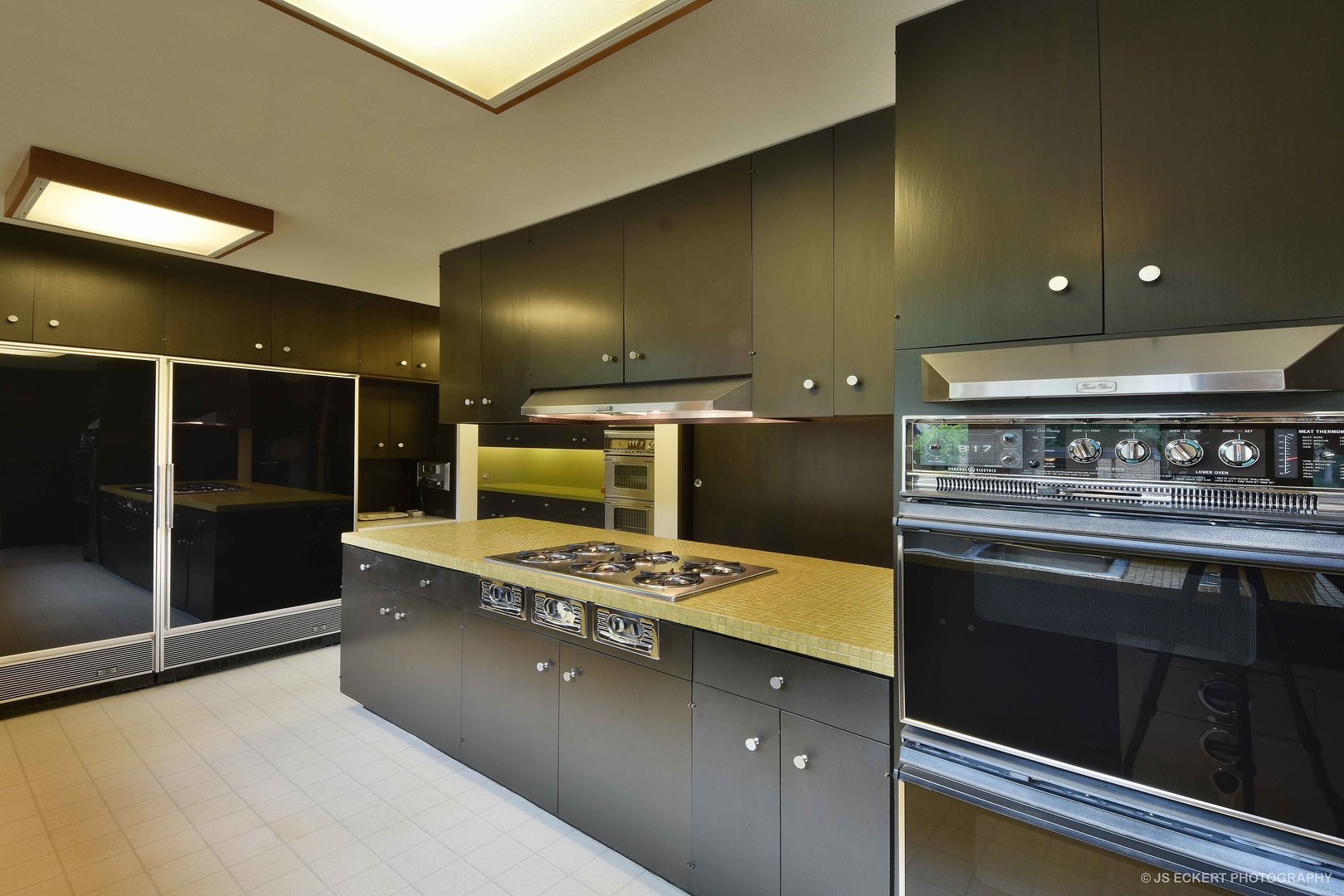 2345 Old Mill Road Lake Forest, IL 60045 - Photo 18 of 73 a stove top oven sitting inside of a kitchen